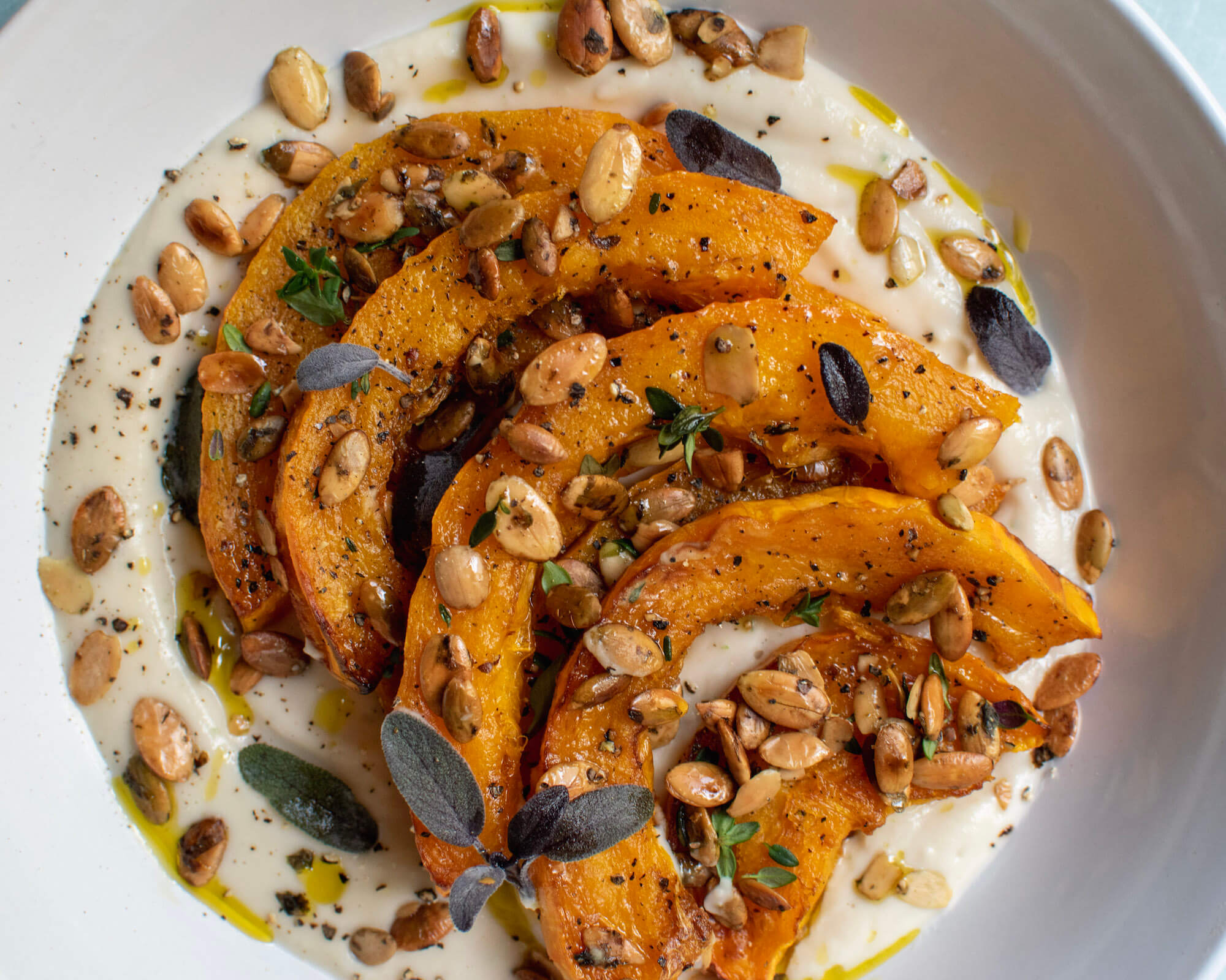 Winter Squash with White Bean Puree & Go Raw Pumpkin Seeds
