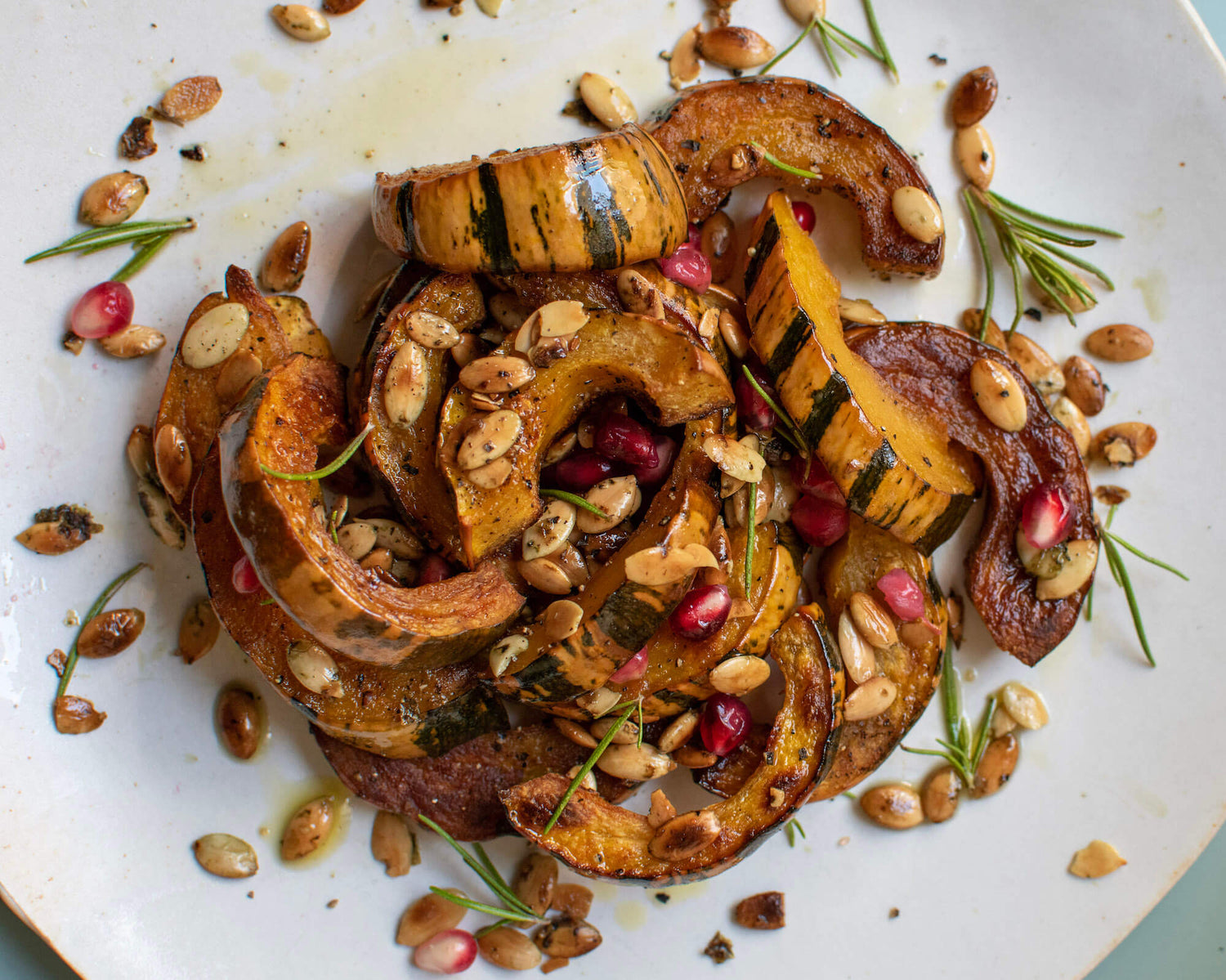 Rosemary Garlic Delicata Squash with Toasted Go Raw Pumpkin Seeds
